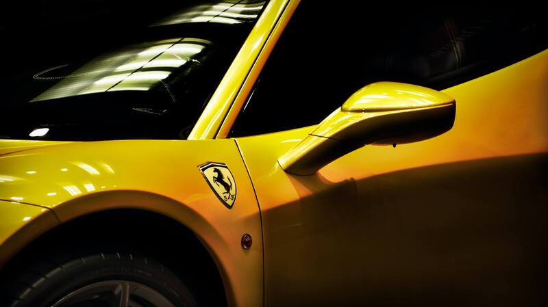 Yellow Ferrari in dim lighting